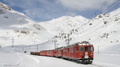 Snow red trains railroad