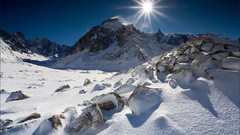 Snow sun Mountains