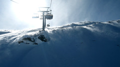 Snow sunlight chairlift