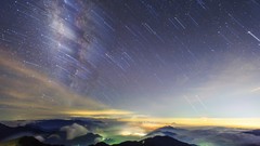 Stars clouds cities night sky