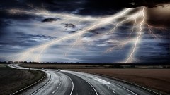 Storm cars lighting roads