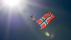 Sun blue skies parachuting flag of norway