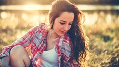 Sun woman looking down blurred sunlight brunettes