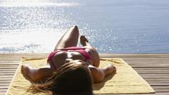 Sunbathing ocean brunettes woman