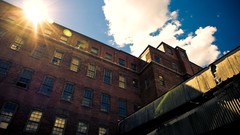 Sunrise sunset sun clouds buildings urban industrial plants