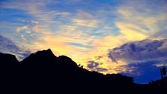 Sunrise sunset Trees yellow sun blue Mountains red orange 