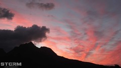 Sunrise sunset Trees yellow sun blue Mountains red pink orange 