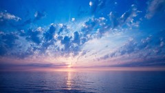 Sunset blue ocean clouds