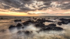 Sunset clouds Seaside rocks Beaches waves long exposure