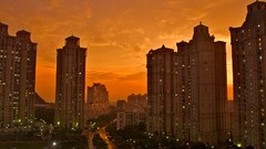 Sunset clouds tower buildings cities skies