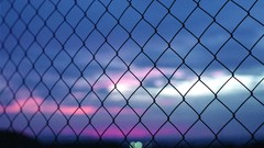 Sunset fences bokeh Chain Link Fence