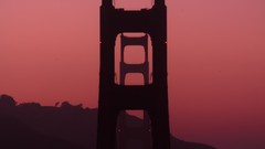 Sunset golden gate bridge light trails