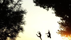 Sunset nature Trees jump woman silhouettes sunlight models