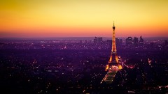 Sunset night purple orange lights Eiffel Tower Paris France 