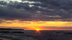 Sunset ocean clouds sun