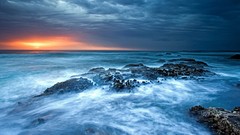 Sunset ocean waves fog