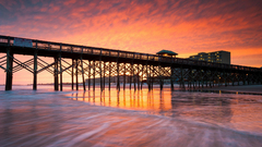 sunset pier beach clouds outdoors water sunlight