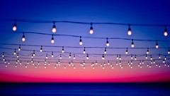 Sunset Sea bokeh skies power lines light bulbs skyland