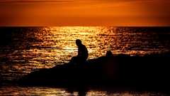 Sunset Sea nature silhouettes lonely sitting rocks Beaches