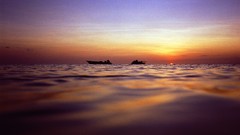 Sunset Sea ships silhouettes