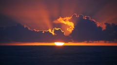 Sunset Sea sun blue clouds skies