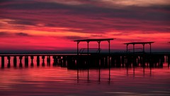 Sunset Sea water silhouettes piers scenic