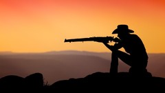 Sunset shooting silhouettes Rifles Cowboys