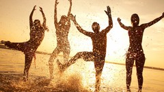 Sunset silhouettes Beaches dancing splashes fun sunlight