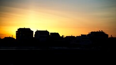 sunset sky sunlight outdoors silhouette House building