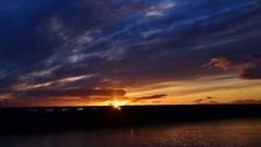 Sunset sun blue clouds light skies