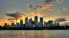 Sunset sun clouds buildings rivers cityscapes