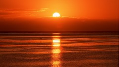 Sunset water clouds red skies