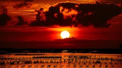 Sunset water clouds silhouettes