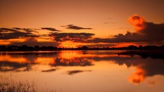 Sunset water clouds skies
