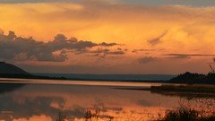 Sunset water Mountains clouds skies