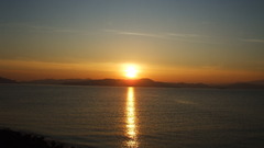 Sunset water reflection skyline