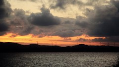 Sunset water sun Mountains clouds skies