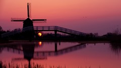 Sunset windmills Netherlands silhouettes lakes