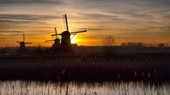 Sunset windmills silhouettes