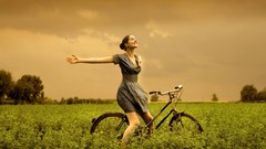 Sunset woman Bicycles fields