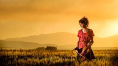 Sunset woman red dress fields violinist Lindsey Stirling