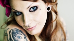 Tattoos blue eyes piercings