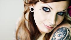 Tattoos woman eyes piercings