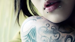 Tattoos woman lips Pierced