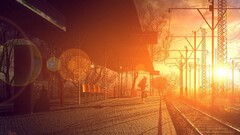 train station sunlight bokeh power lines cobblestone lens flare