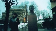 Trees snow Men statues Lenin Russia Cigarettes smoking 