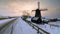 Trees snow winter sun blue ice windmills roads houses skies