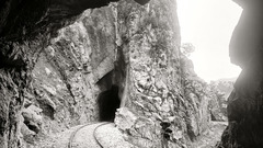 Tunnels grayscale railroad tracks