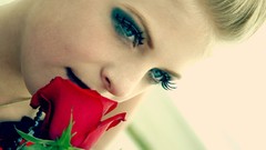 Turquoise blue eyes red rose