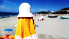 Umbrellas Beaches blue skies depth of field